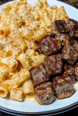 CAJUN STEAK TIPS IN CHEESY RIGATONI PARMESAN SAUCE